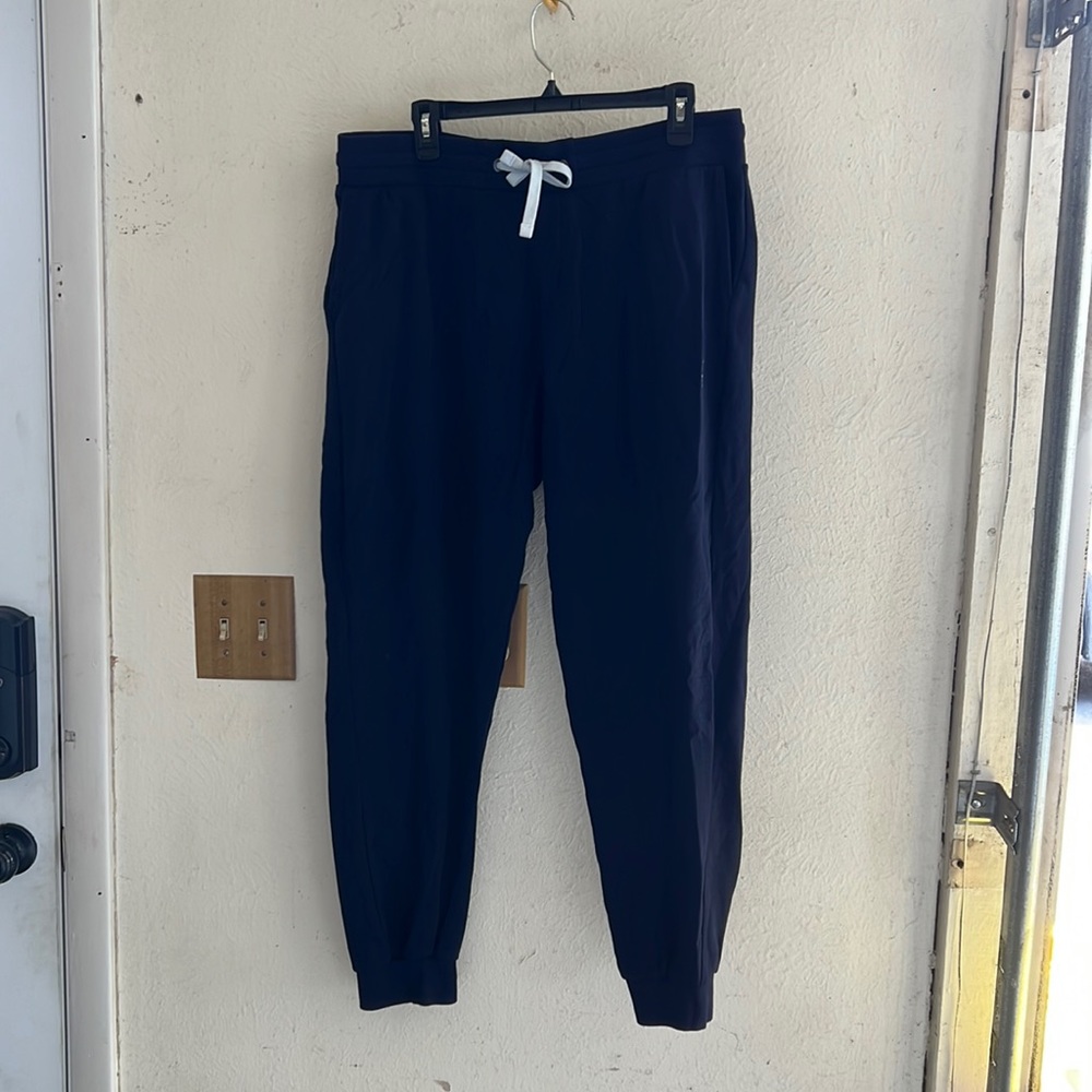 Men’s polo warm up suit, pants are 2XL and top is LG